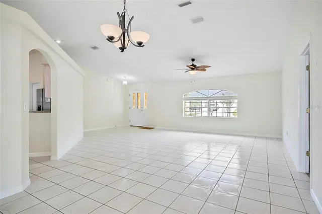 a large kitchen with cabinets and stainless steel appliances