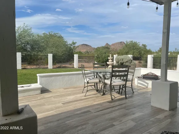 a view of a terrace with furniture and garden