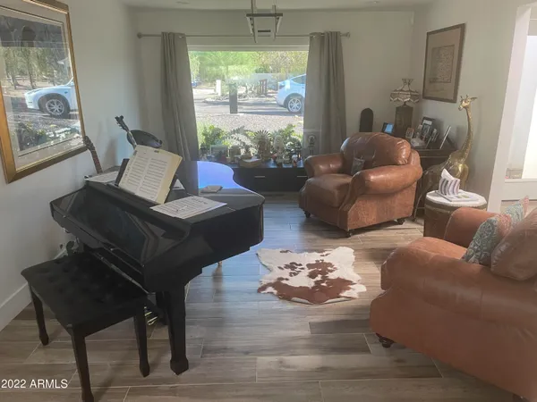 a living room with furniture and a large window