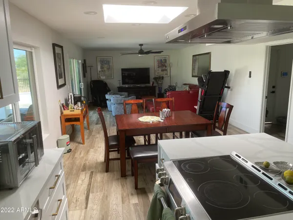 a view of a dining room with furniture and wooden floor