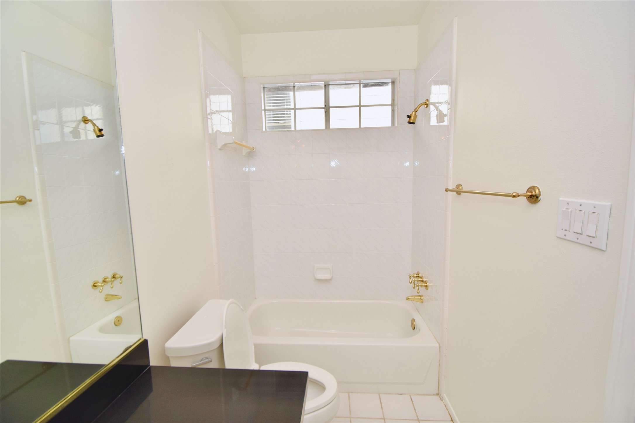 2024 Welch Street Houston, TX 77019 - Photo 12 of 18 a bathroom with a bathtub and shower