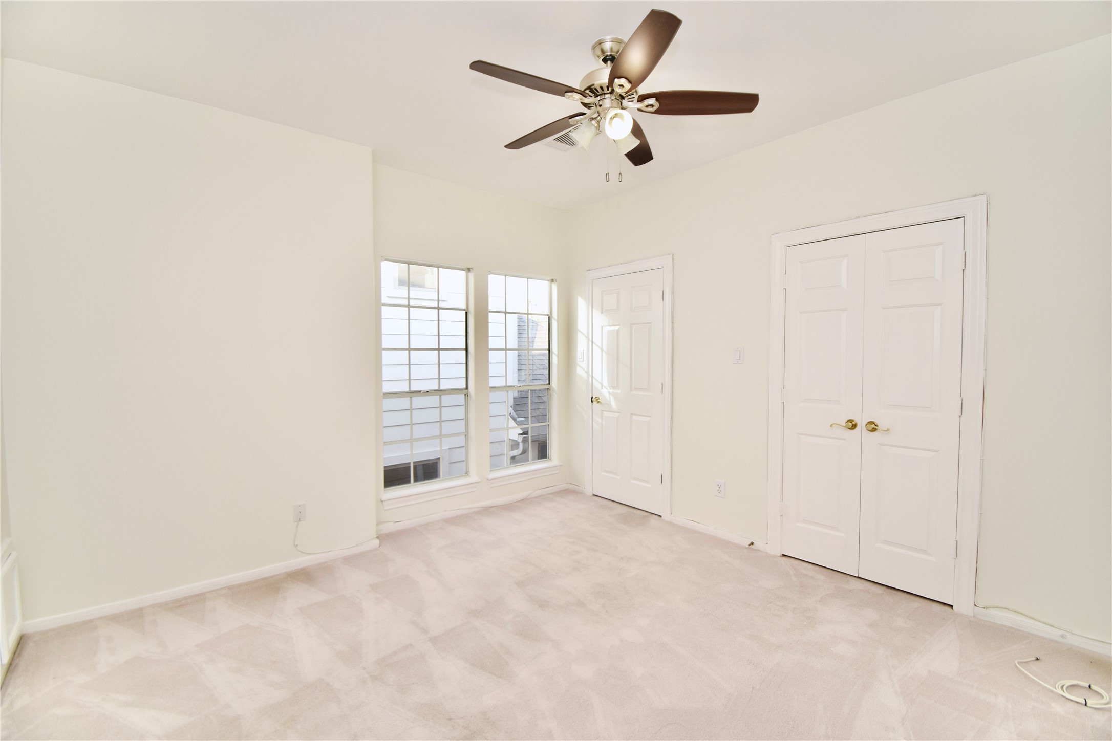 2024 Welch Street Houston, TX 77019 - Photo 14 of 18 an empty room with fan