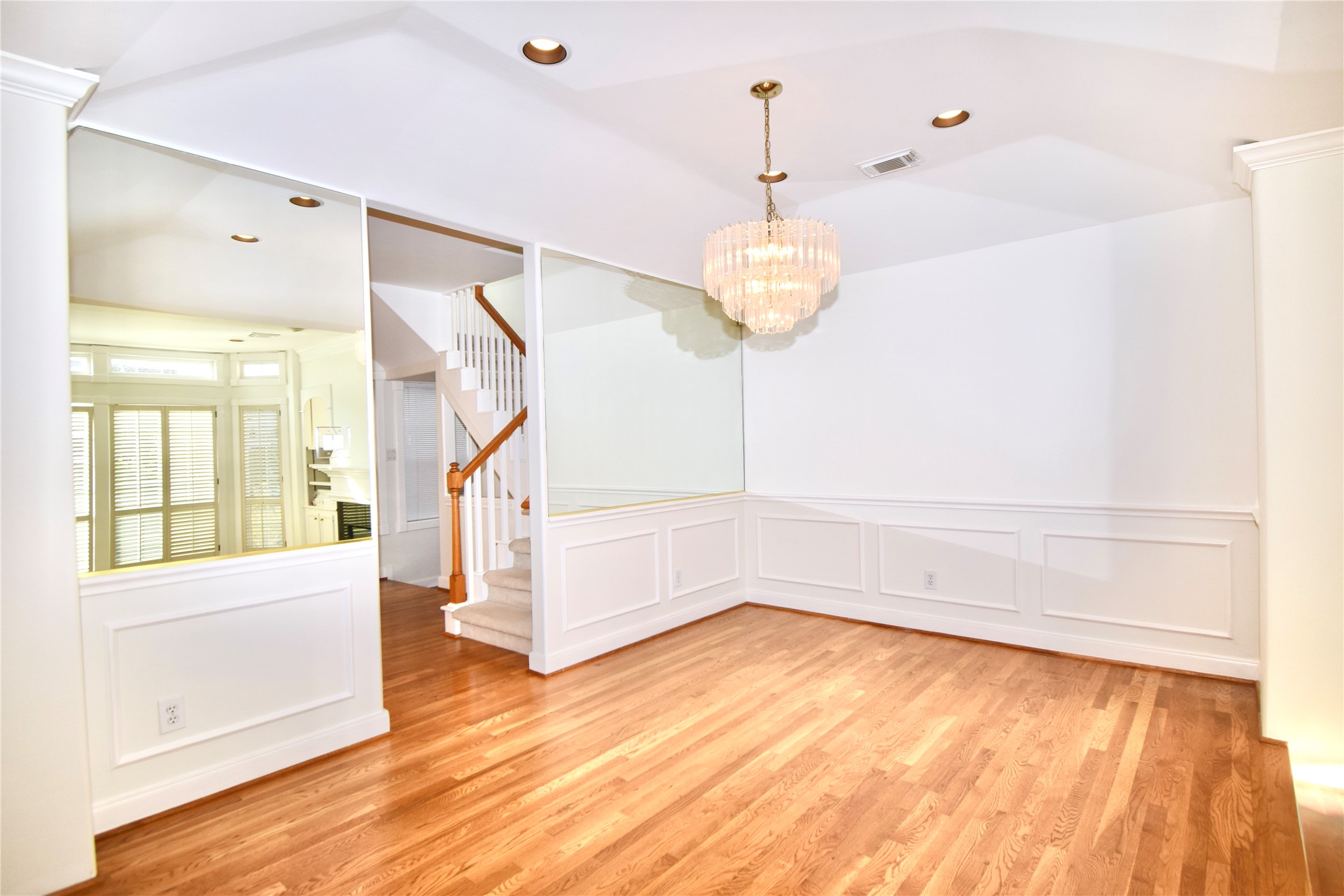 2024 Welch Street Houston, TX 77019 - Photo 4 of 18 a view of empty room with wooden floor and fan