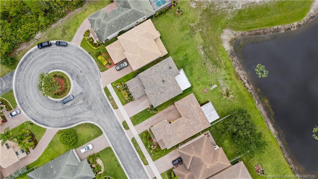 1268 Southeast Kirk Street Stuart, FL 34997 - Photo 52 of 63 an aerial view of residential house with outdoor space and swimming pool