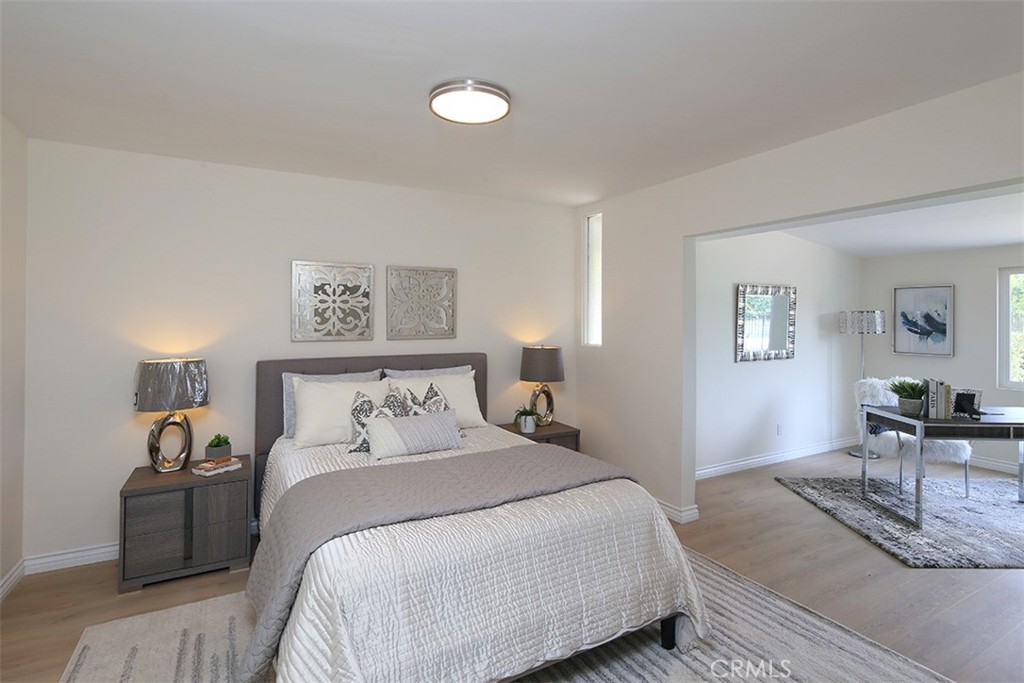 255 Sharon Road Arcadia, CA 91007 - Photo 18 of 29 a bedroom with a bed and lamp