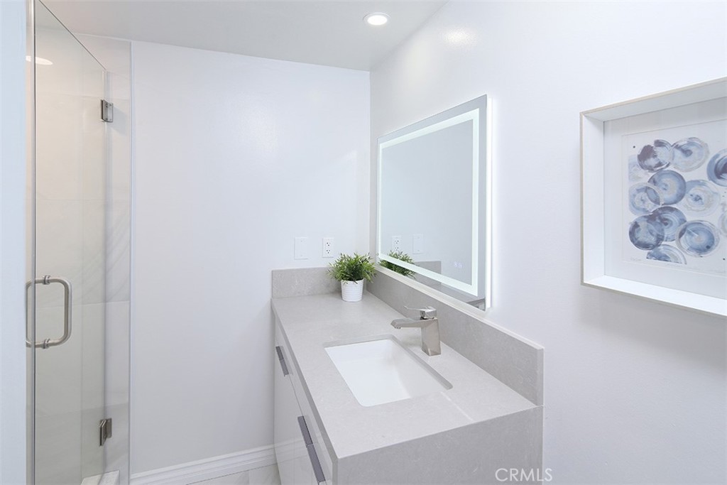 255 Sharon Road Arcadia, CA 91007 - Photo 22 of 29 a bathroom with a sink and a mirror