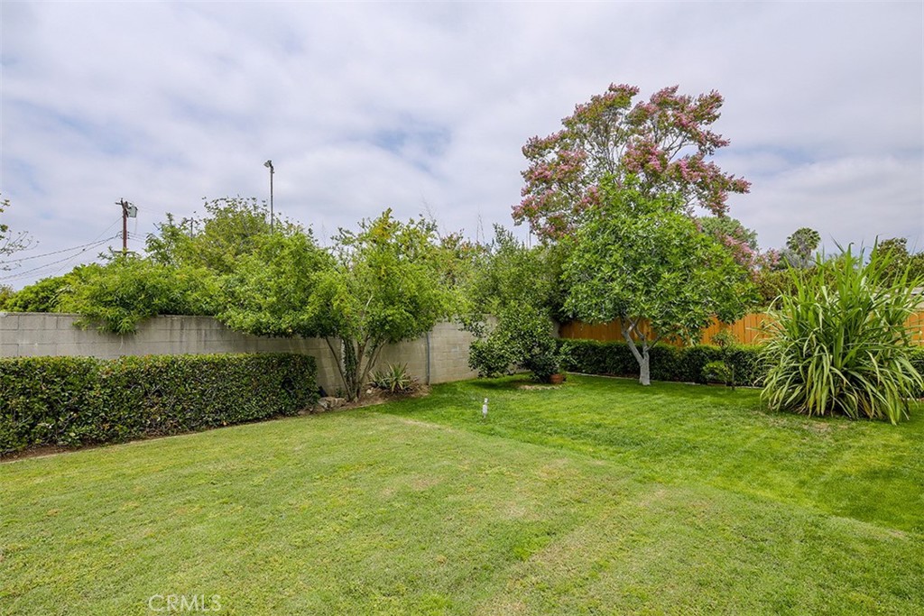 255 Sharon Road Arcadia, CA 91007 - Photo 25 of 29 a backyard of a house with lots of green space and lake view