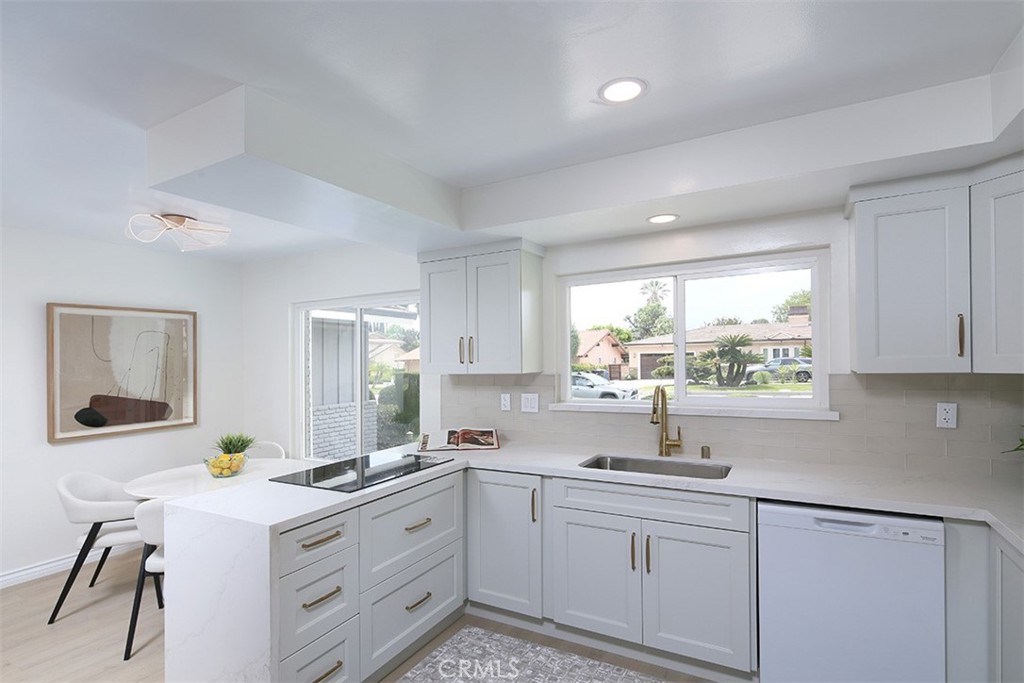 255 Sharon Road Arcadia, CA 91007 - Photo 7 of 29 a kitchen that has a sink and a stove in it