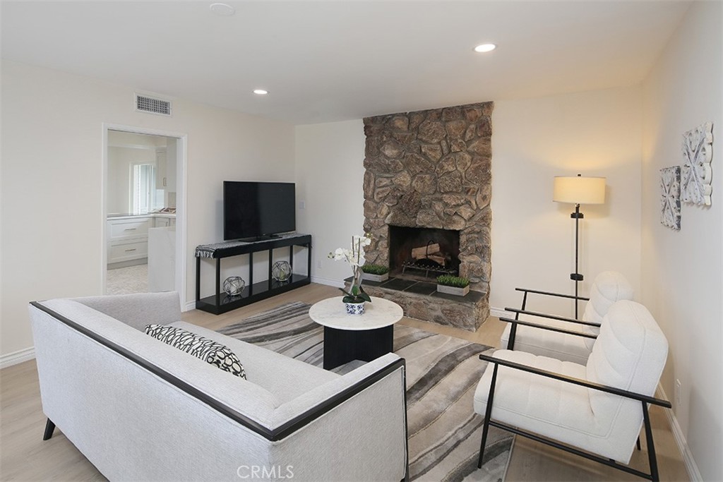 255 Sharon Road Arcadia, CA 91007 - Photo 10 of 29 a living room with furniture and a fireplace