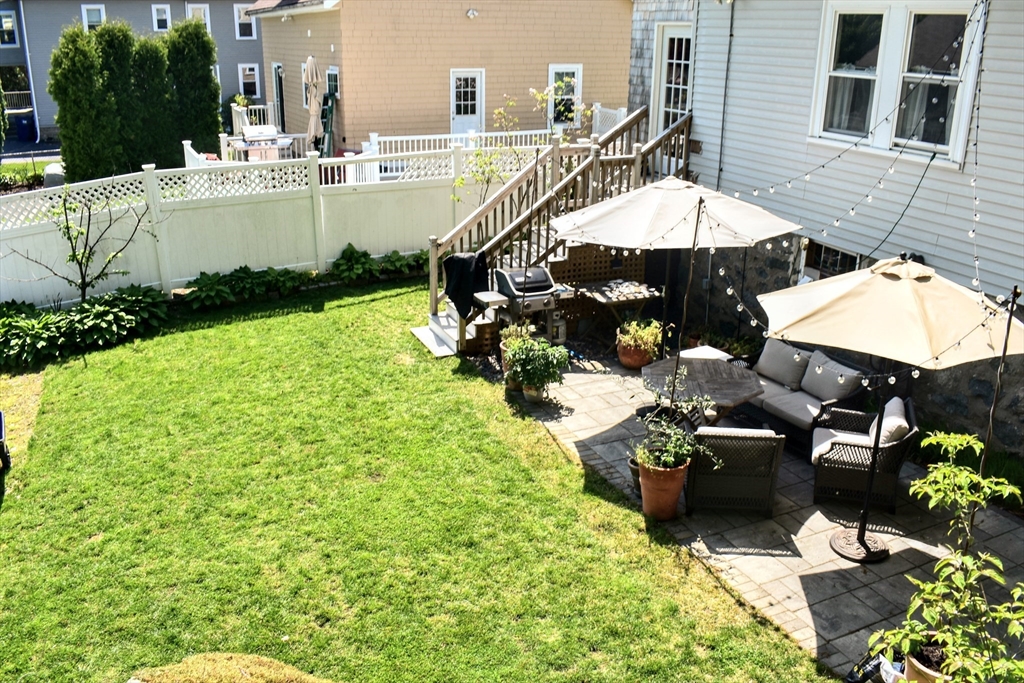 12 Searle Road, Unit 12 Boston, MA 02132 - Photo 11 of 35 a view of a house with backyard porch and sitting area