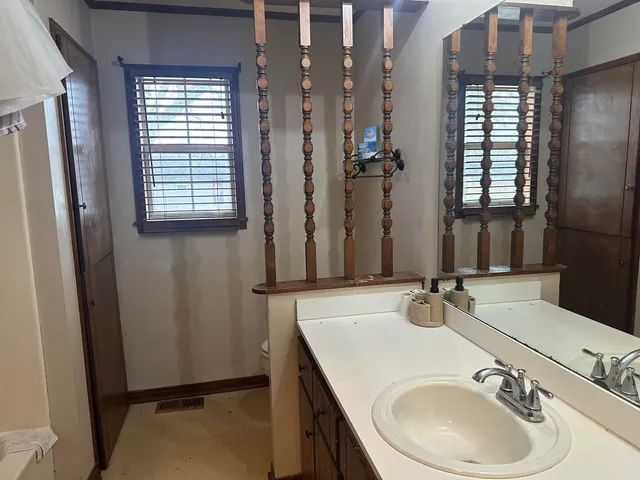 a bathroom with a sink double vanity and a mirror