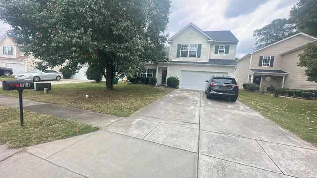a view of house with outdoor space