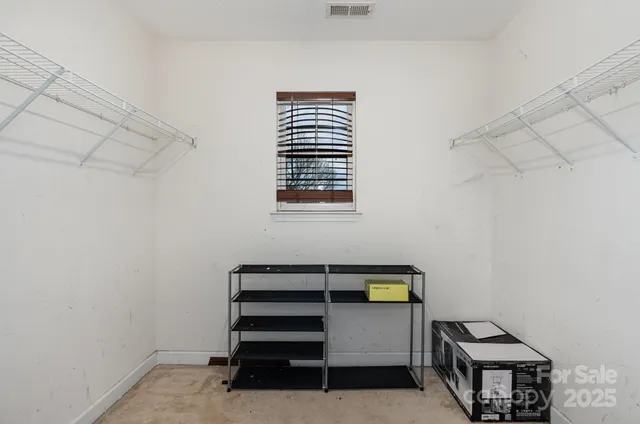 a view of room with stairs and a cabinet