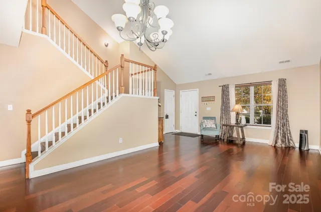 a view of an entryway with wooden floor
