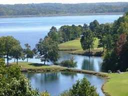 202 White Eagle Drive Waleska, GA 30183 - Photo 5 of 5 a view of a lake with a yard and mountain view