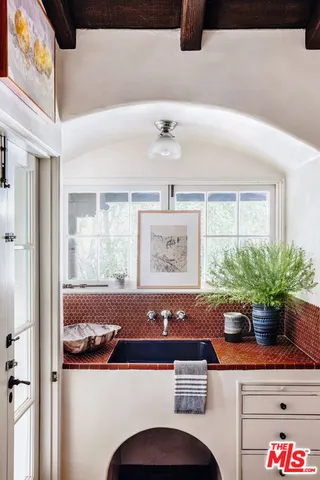a view of living room with furniture and potted plant