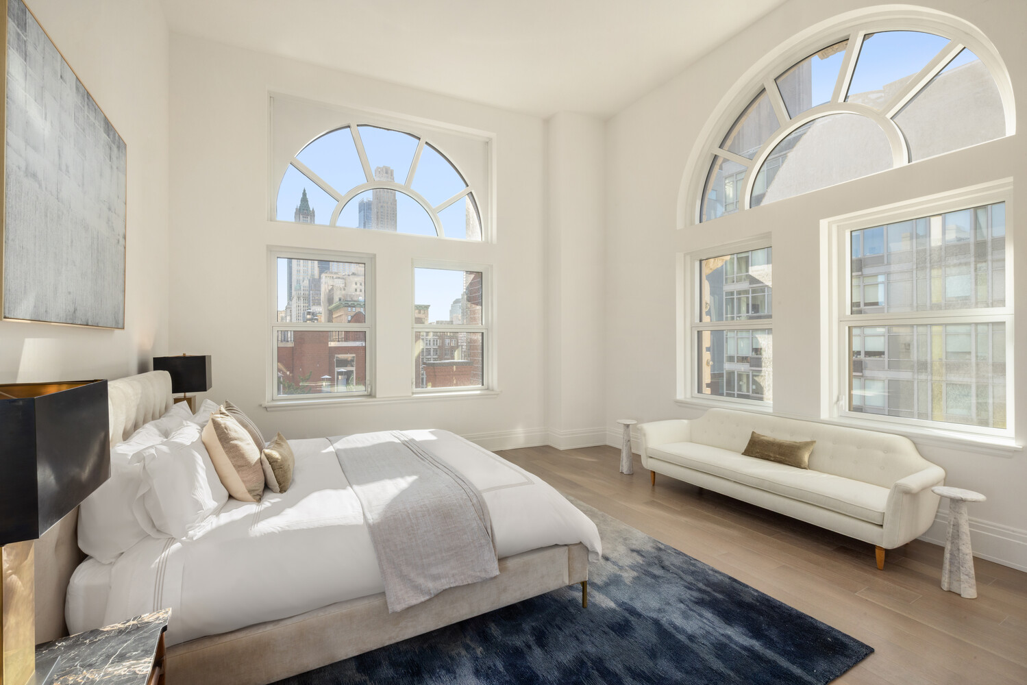 108 Leonard Street, Unit PHW Manhattan, NY 10013 - Photo 7 of 33 a spacious bedroom with a bed and a couch