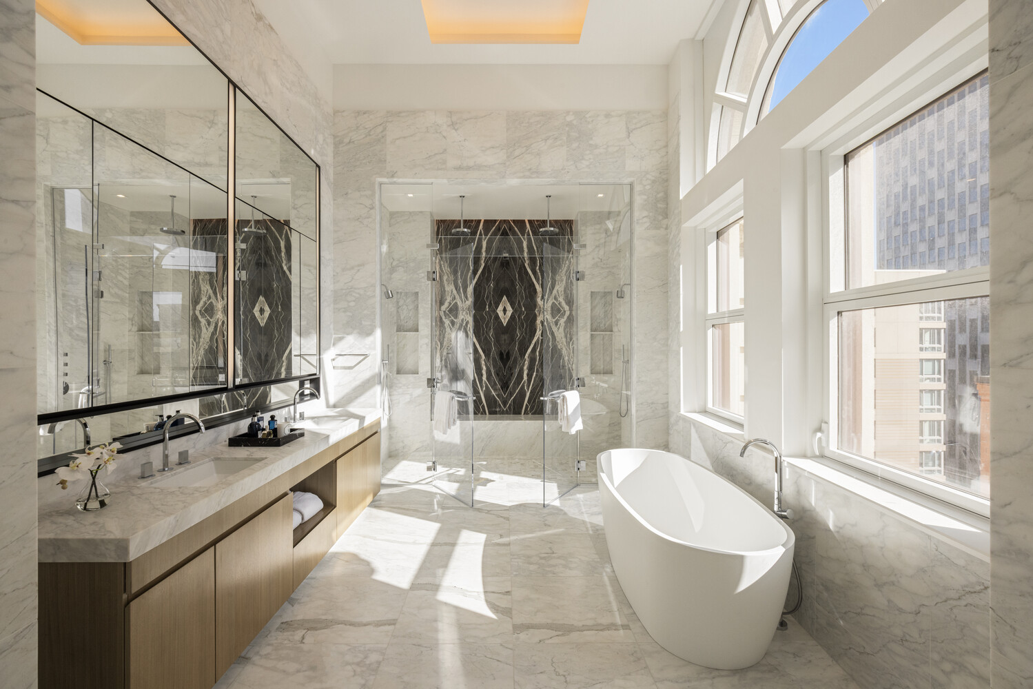 108 Leonard Street, Unit PHW Manhattan, NY 10013 - Photo 8 of 33 a bathroom with a tub sink and mirror