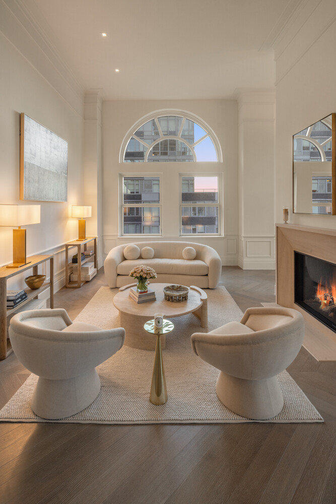 108 Leonard Street, Unit PHW Manhattan, NY 10013 - Photo 3 of 33 a living room with large couches and a fireplace