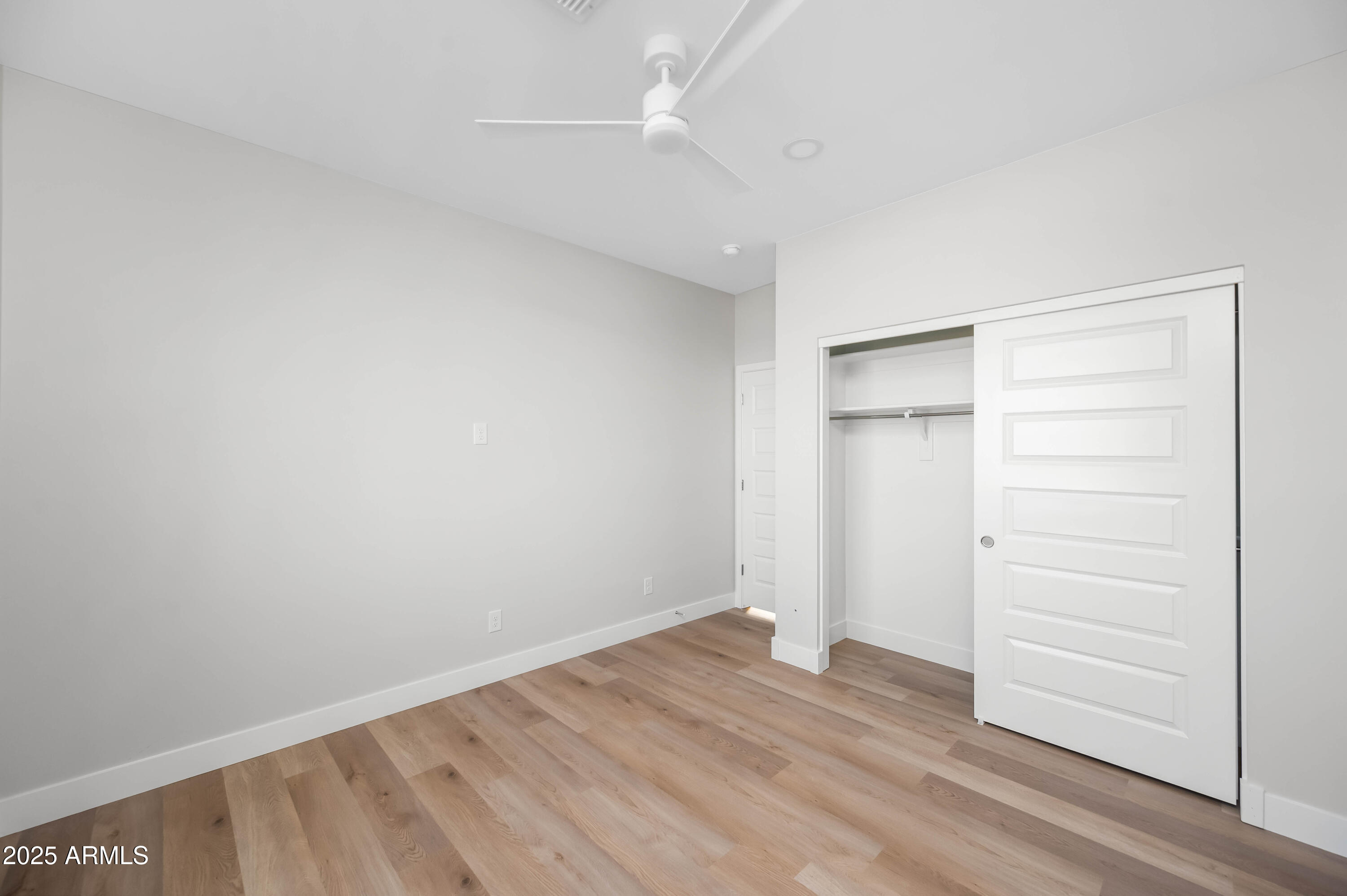 2103 Hassayampa Road Tonopah, AZ 85354 - Photo 18 of 37 a view of empty room with wooden floor
