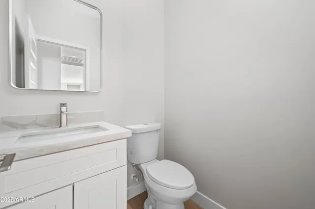 a bathroom with a sink and cabinets