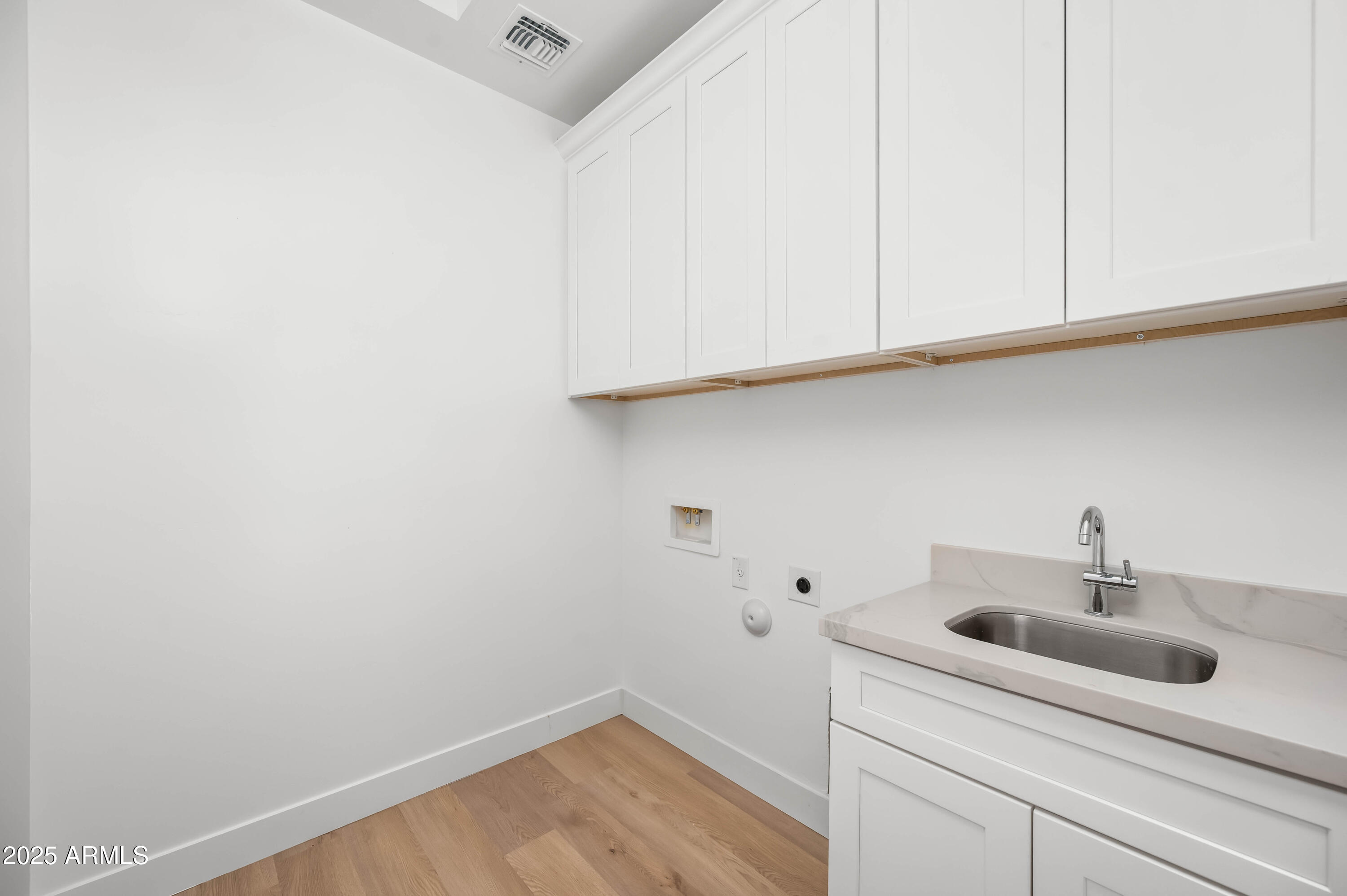 2103 Hassayampa Road Tonopah, AZ 85354 - Photo 24 of 37 a bathroom with a sink and cabinets
