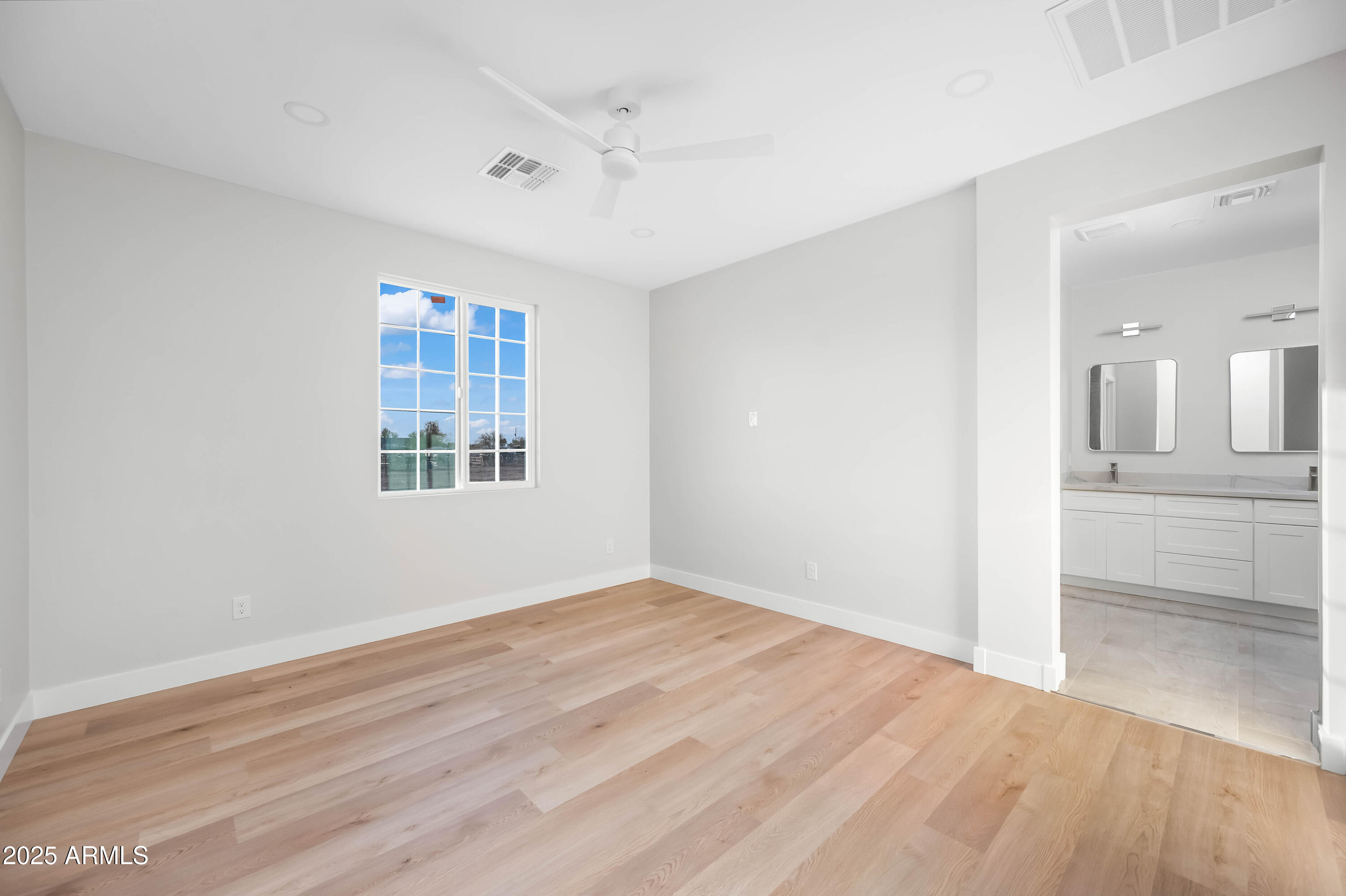 2103 Hassayampa Road Tonopah, AZ 85354 - Photo 26 of 37 wooden floor in an empty room with a window