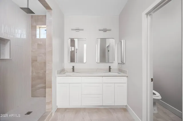 a bathroom with a tub sink and mirror