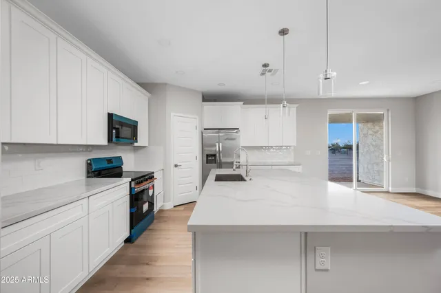 a view of kitchen with wooden floor