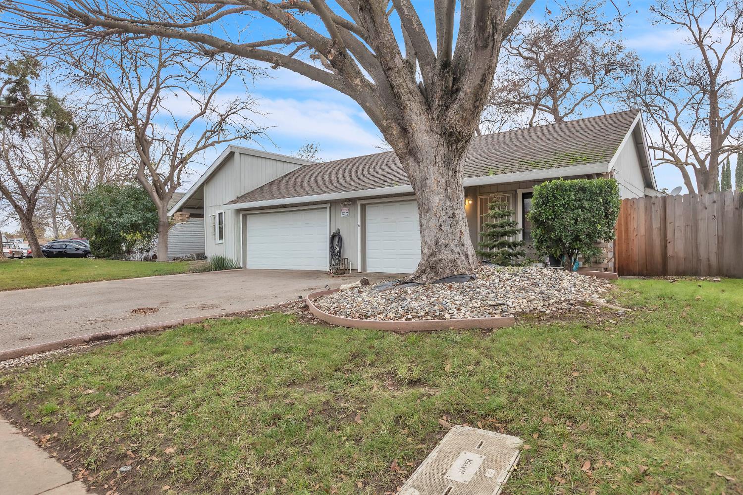 10973 Hirschfeld Way Rancho Cordova, CA 95670 - Photo 1 of 41 a front view of a house with a yard and garage
