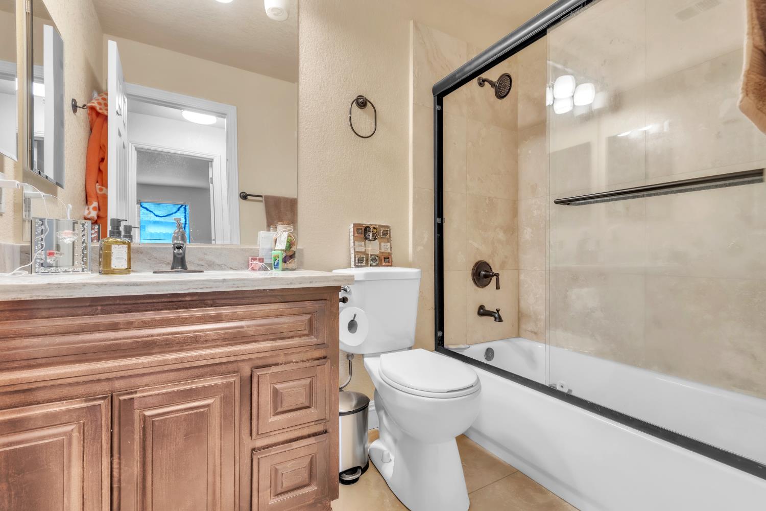 10973 Hirschfeld Way Rancho Cordova, CA 95670 - Photo 19 of 41 a bathroom with a sink a toilet a mirror and shower