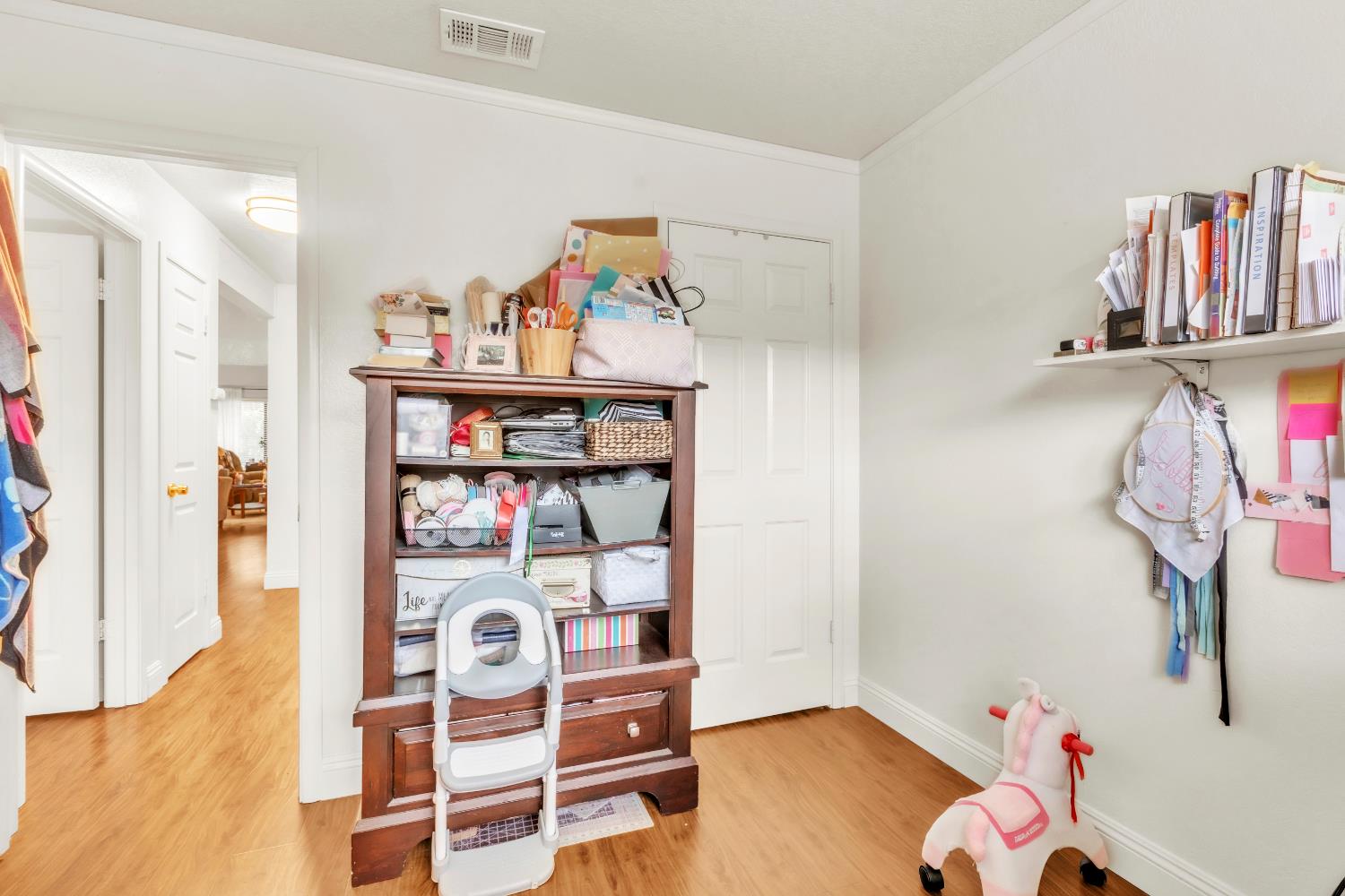 10973 Hirschfeld Way Rancho Cordova, CA 95670 - Photo 29 of 41 a bedroom with furniture and a book shelf