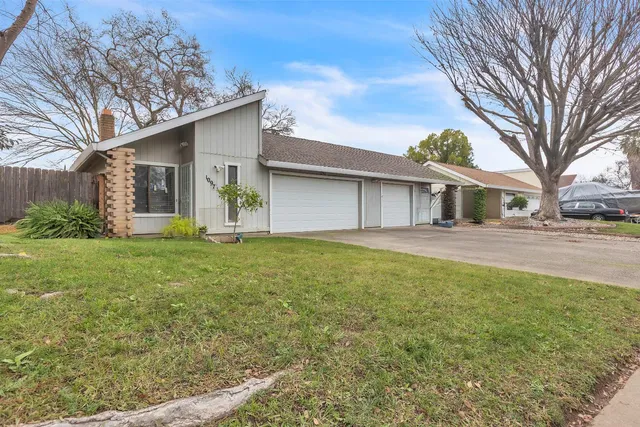 a house view with garden space