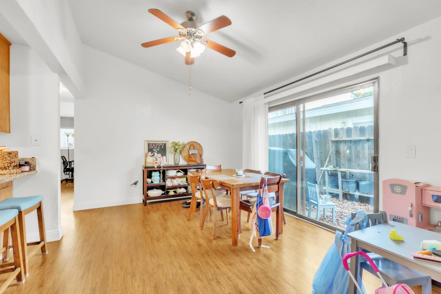 10973 Hirschfeld Way Rancho Cordova, CA 95670 - Photo 32 of 41 a living room with furniture and a floor to ceiling window