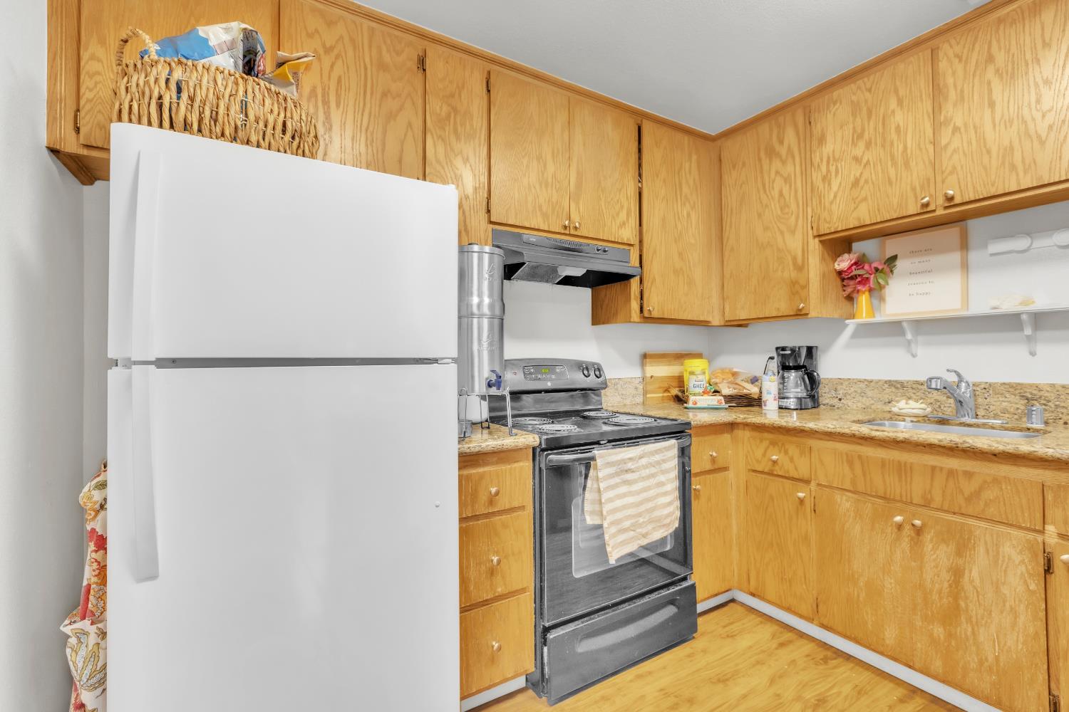 10973 Hirschfeld Way Rancho Cordova, CA 95670 - Photo 33 of 41 a kitchen with stainless steel appliances granite countertop a refrigerator a stove and a sink