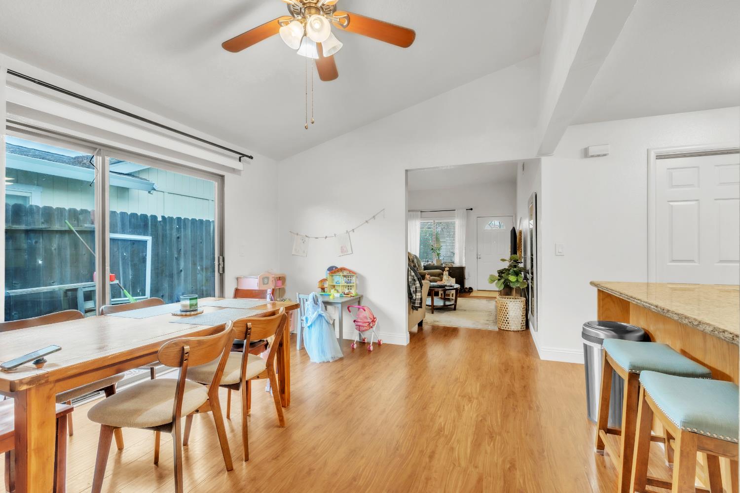10973 Hirschfeld Way Rancho Cordova, CA 95670 - Photo 36 of 41 a living room with furniture a dining table and wooden floor