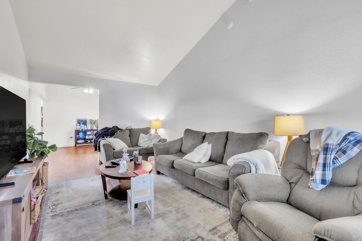 10973 Hirschfeld Way Rancho Cordova, CA 95670 - Photo 38 of 41 a living room with furniture and a flat screen tv