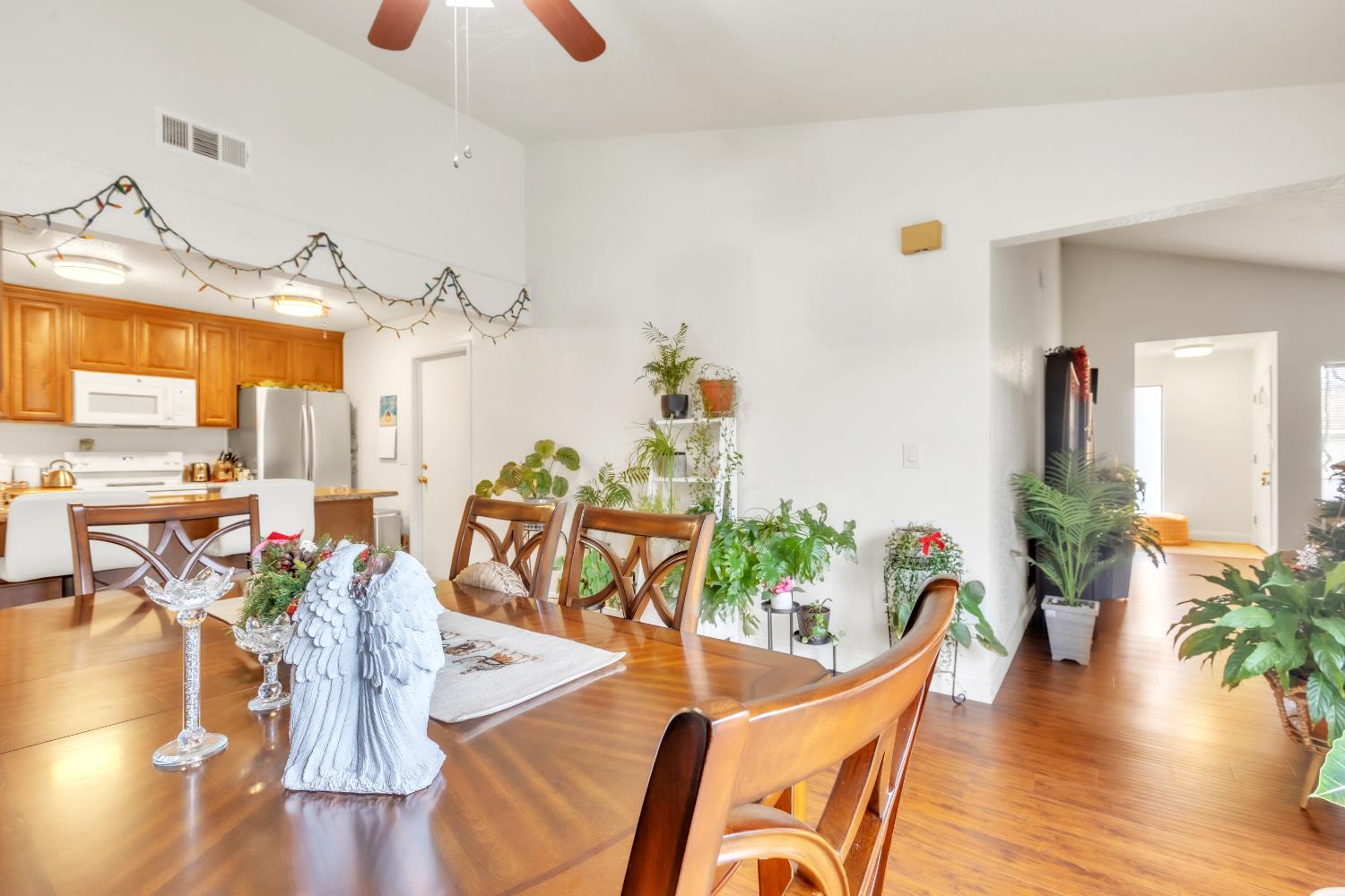 10973 Hirschfeld Way Rancho Cordova, CA 95670 - Photo 7 of 41 a view of a dining room with furniture and wooden floor