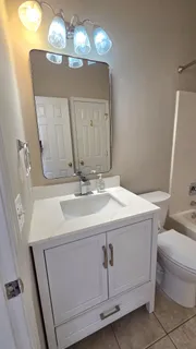 a view of a hallway with stairs