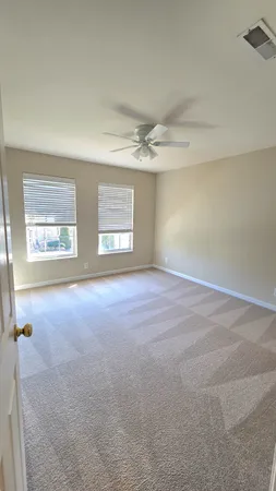 a bath tub sitting in a room next to a window