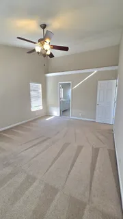 a view of a balcony with wooden floor