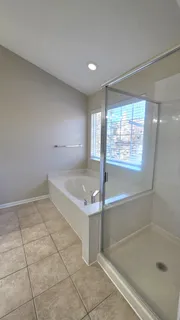 a view of a yard with snow on the road