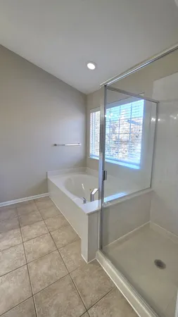 a view of a yard with snow on the road