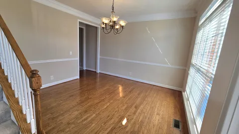 a view of an empty room with windows