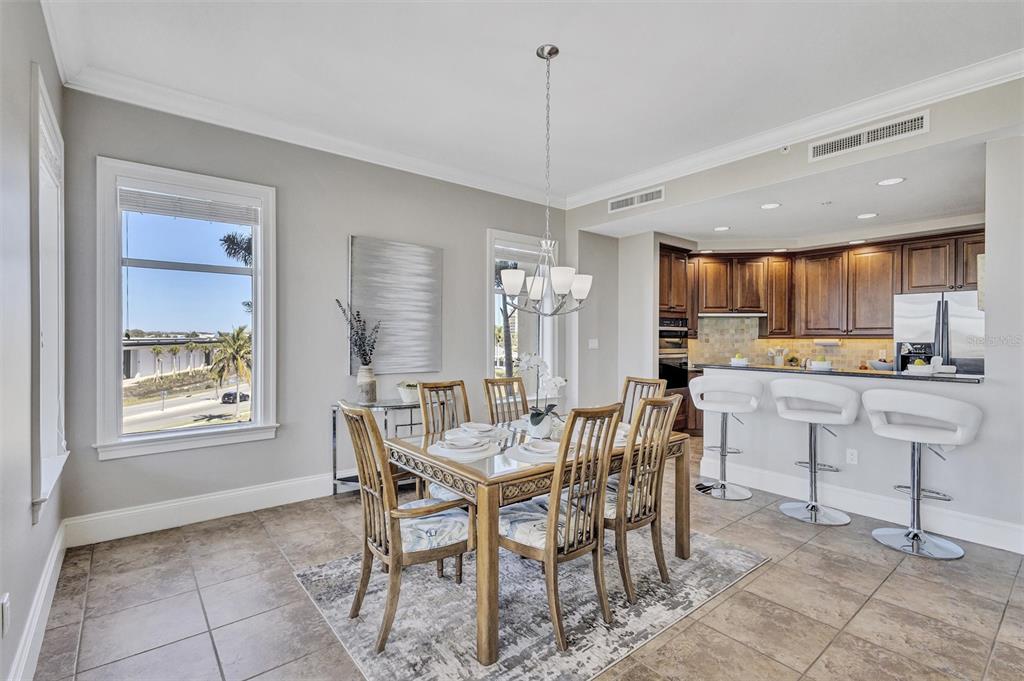 140 Riviera Dunes Way, Unit 206 Palmetto, FL 34221 - Photo 9 of 46 a view of a dining room with furniture
