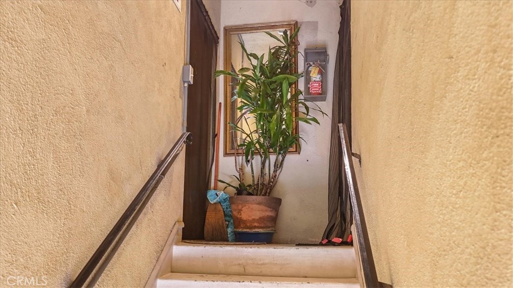 9706 Alondra Boulevard Bellflower, CA 90706 - Photo 17 of 24 a view of a potted plant in front of a door