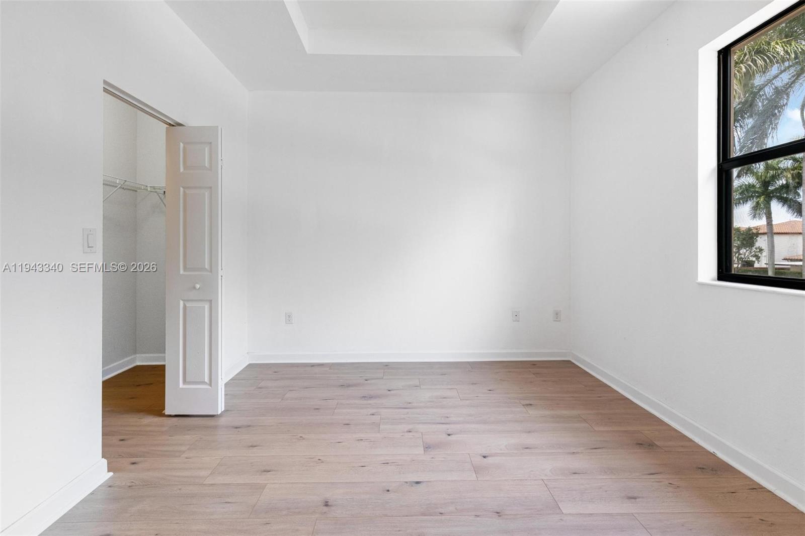 749 Southeast 32nd Terrace, Unit 749 Homestead, FL 33033 - Photo 14 of 27 wooden floor in an empty room