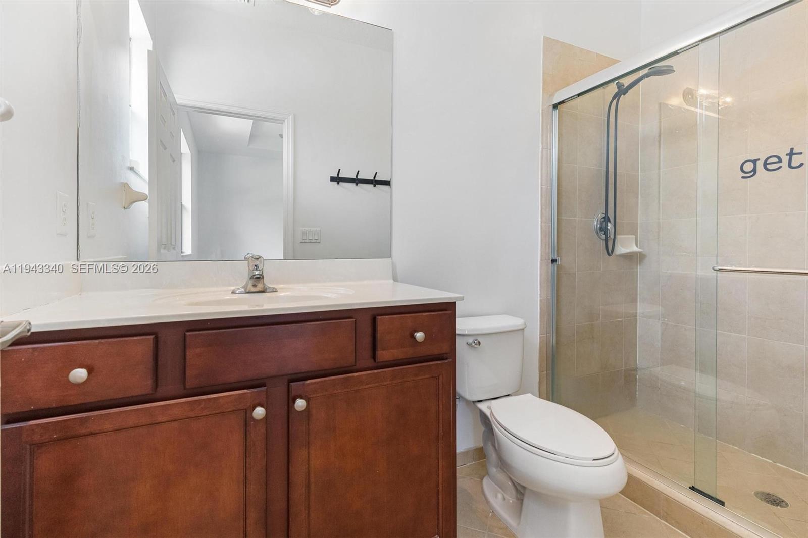 749 Southeast 32nd Terrace, Unit 749 Homestead, FL 33033 - Photo 16 of 27 a bathroom with a sink a toilet and shower