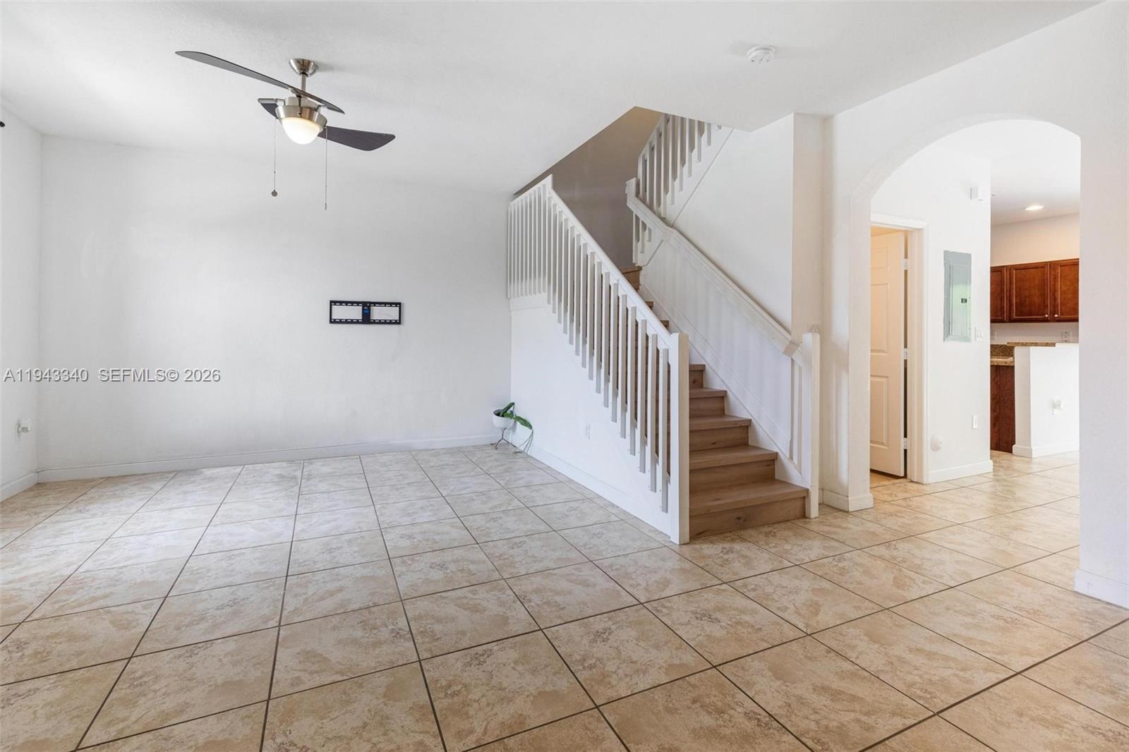 749 Southeast 32nd Terrace, Unit 749 Homestead, FL 33033 - Photo 6 of 27 a view of a livingroom with wooden floor and stairs