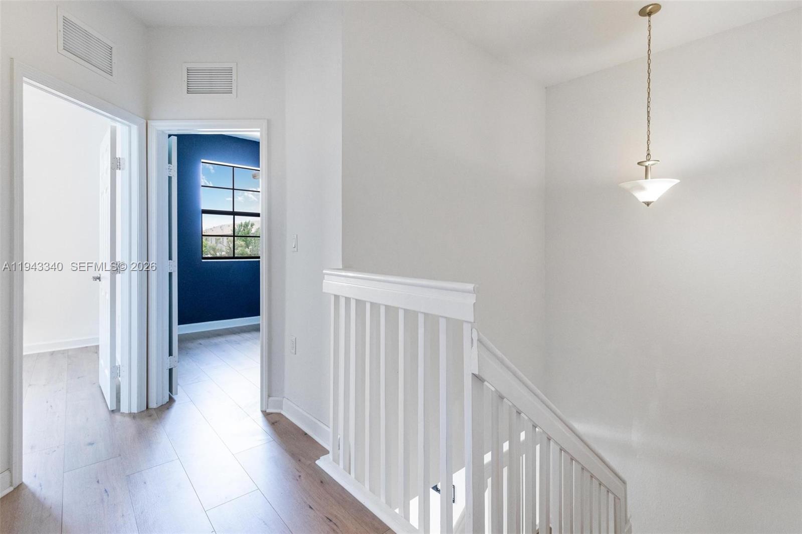749 Southeast 32nd Terrace, Unit 749 Homestead, FL 33033 - Photo 7 of 27 a view of hallway with wooden floor